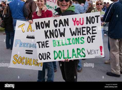 Women carrying political protest signs at San Jose Tea Party Stock Photo - Alamy