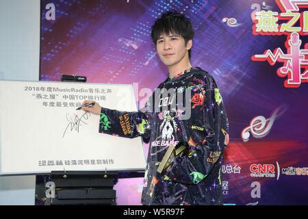 Chinese singer and actor Wowkie Zhang, also known as Da Zhang Wei, poses with his trophy after ...