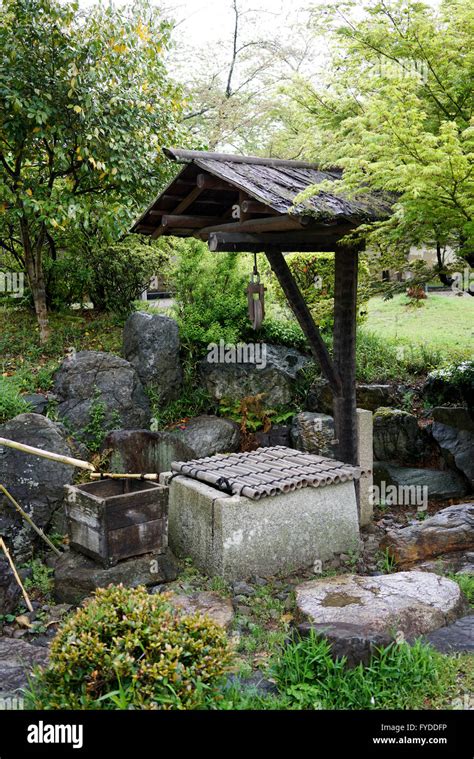 Traditional ancient stone well in japanese garden Stock Photo - Alamy