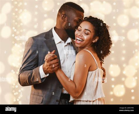 Beautiful happy black couple dancing in modern restaurant Stock Photo ...