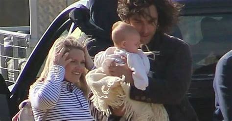 Poldark star Aidan Turner pictured cuddling cute baby on Holywell Bay set in Newquay - Cornwall Live