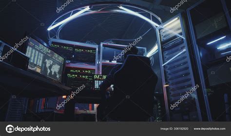 Hacker using computer with multiple monitors Stock Photo by ...