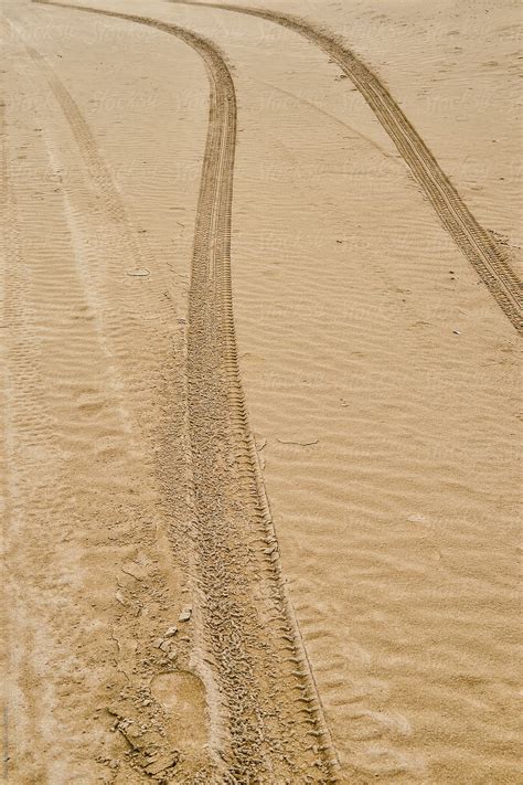 "Tire Tracks In The Sand" by Stocksy Contributor "Bisual Studio" - Stocksy