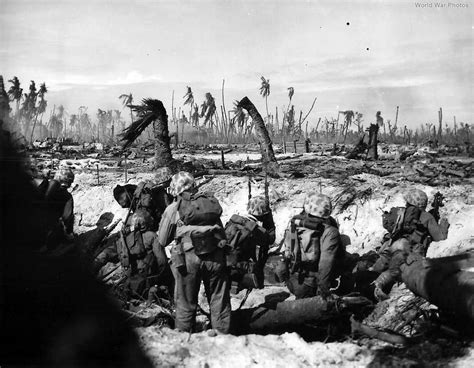 4th Division Marines scan the front on blasted Roi Namur Island | World War Photos