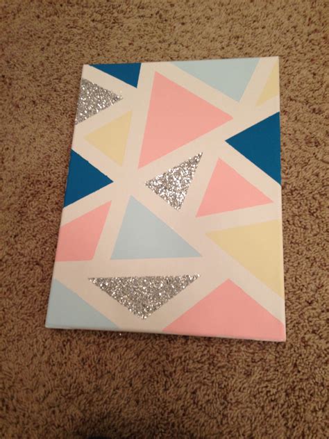 DIY canvas 1. Tape geometric shapes with painter's tape 2. Paint inside them with acrylic paint ...