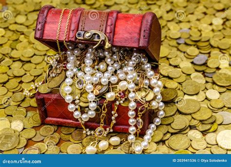 Vintage Treasure Chest Full Of Gold Coins And Jewelry On A Background Of Golden Coins Stock ...