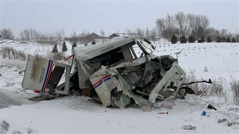 Postal truck driver seriously injured in head-on crash