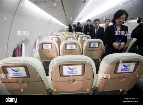 Visitors are pictured in a full-scale model of the C919 jet plane of ...