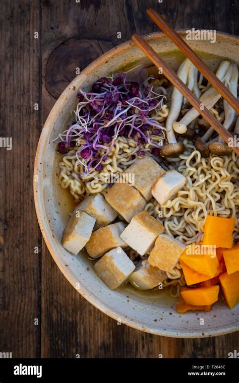 Miso Ramen soup with noodles, red radish sprouts, pumpkin, fried tofu ...