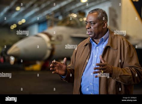 U.S. Secretary of Defense Lloyd J. Austin III, center, speaks with ...