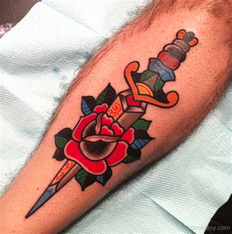 Flower And Dagger Tattoo | Tattoo Designs, Tattoo Pictures