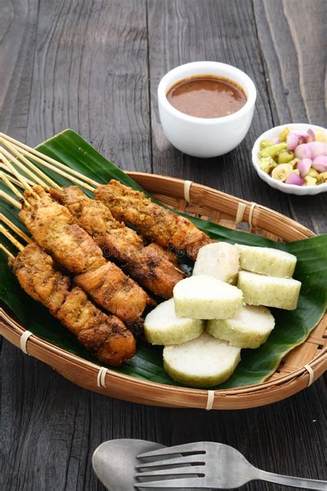 Sate Ayam (Chicken Satay) with Peanut Sauce and Lontong (rice Cake) Stock Photo - Image of asian ...