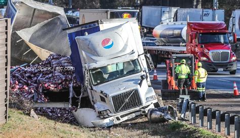 Pepsi truck crashes into barrier, jams I-285 through Cobb