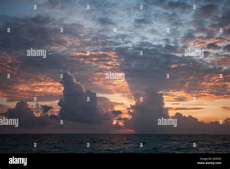 Maldives sunset from the beach Stock Photo - Alamy