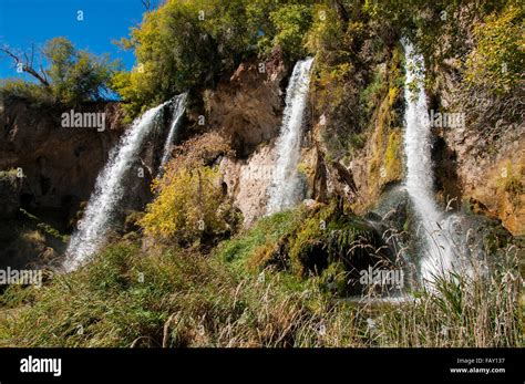 Triple waterfall out of rock ledge Stock Photo - Alamy