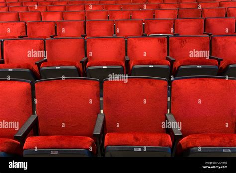 Red velvet concert hall seating background Stock Photo - Alamy