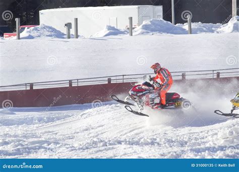 Red And Black Polaris Snowmobile Racing Over Jump Editorial Image - Image: 31000135