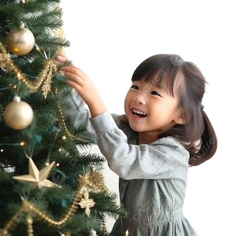 Asian Little Girl Is Decorating Christmas Tree And Enjoying Christmas Time, Christmas Family ...