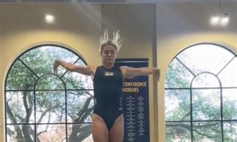 LSU Gymnast Olivia Dunne Show Flexibility and Long Legs on Balance Beam - BlackSportsOnline