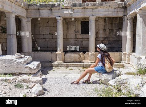 Woman traveller exploring ancient ruins Stock Photo - Alamy