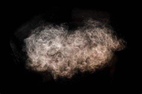 Premium Photo | Brown powder explosion with black space