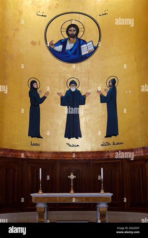 Saint George maronite cathedral, Beirut, Lebanon. Chancel altar and frescoes depicting ...