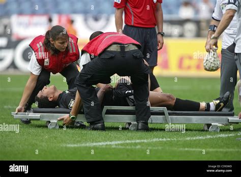 Injured football player on a stretcher Stock Photo - Alamy