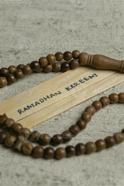 Islamic quotes. Ramadhan Kareem text on wooden stick. 21221466 Stock Photo at Vecteezy