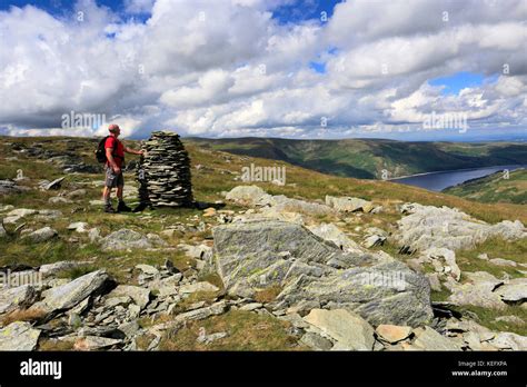 Walker at the cairns on Artle crag, Branstree fell, Haweswater ...