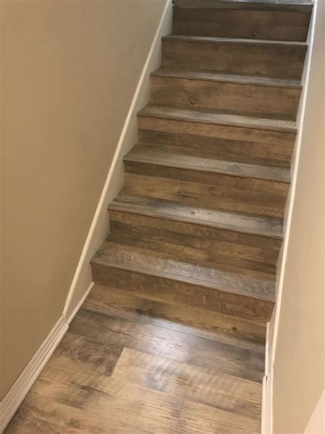 Extend vinyl planks from basement floor up the stairs? Looks nice ...