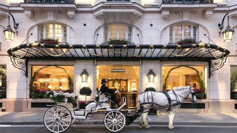 a horse drawn carriage in front of a hotel