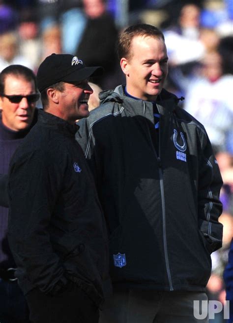 Photo: Indianapolis Colts quarterback Peyton Manning talks to Ravens ...