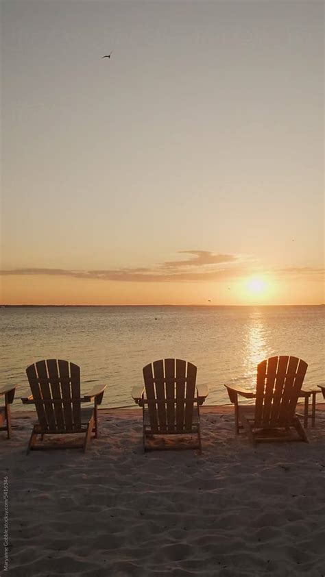 "Summer Sunset Beach Chairs" by Stocksy Contributor "Maryanne Gobble" - Stocksy