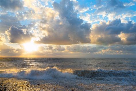 A Sunset during the Sea Storm. Beautiful Landscape by the Sea Stock ...