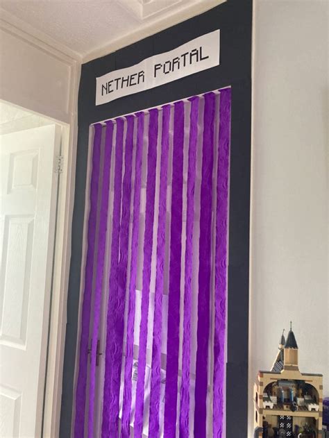 a purple curtain is hanging on the wall in front of a door with a sign that reads nether football