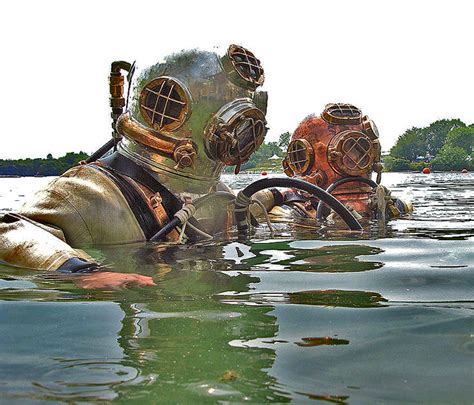 Mark V Divers | Two divers use classic Mark V diving helmets… | Flickr