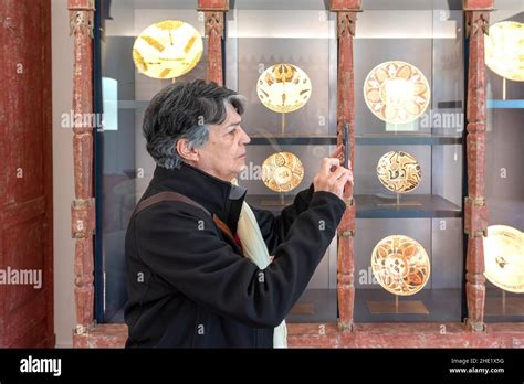 Senior Latin American woman browsing the exhibits. The Aga Khan Museum is a museum of Islamic ...