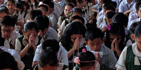 Filipino Praying In Church