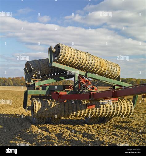 A plow tool in farmer field against the blue sky Stock Photo - Alamy