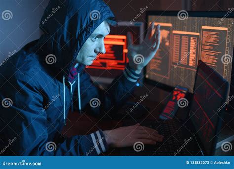 Male Hacker Celebrates Success with a Hand Gesture. a Successful Attempt at System Hacking and ...