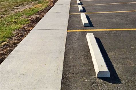 Parking Lot Bollards & Car Stops - Gann Asphalt & Concrete