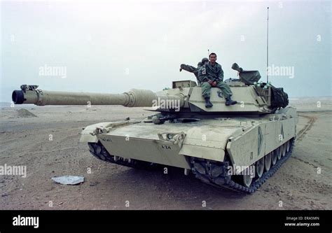 23rd March 1991 A U.S. Army tank crew member sits on his M1A1 Abrams ...