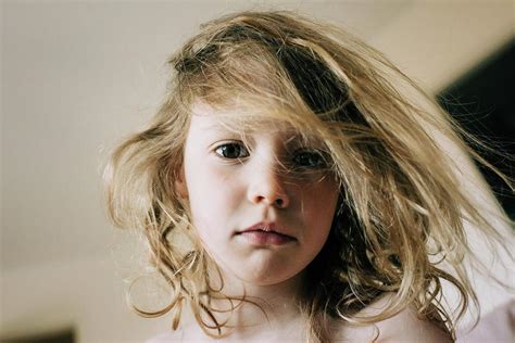 Candid Portrait Of Young Girl With Bed Head Hair In The Morning Photograph by Cavan Images ...