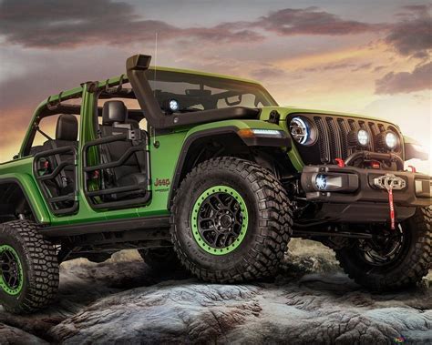 A state-of-the-art, powerful and majestic Jeep in green and black on ...