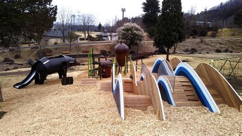 there are many surfboards in the sand at this play area that is made ...