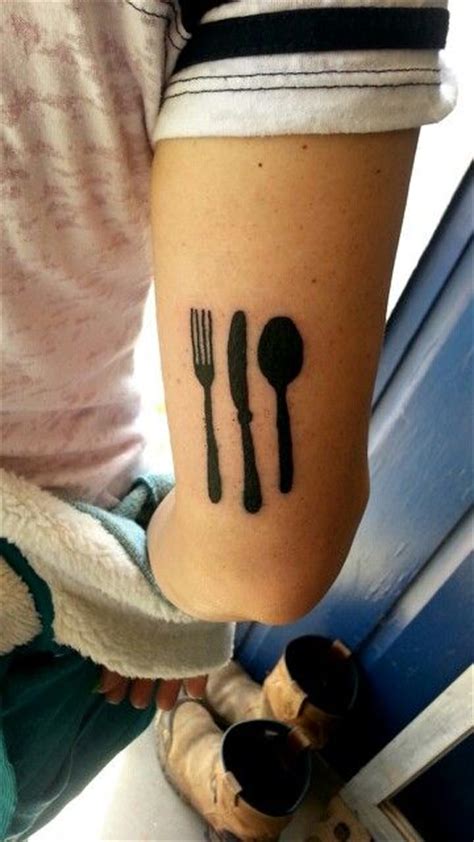 Nice Spoon With Knife And Fork Silhouette Tattoo On Triceps