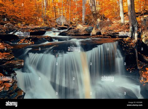 Autumn waterfalls in park with colorful foliage Stock Photo - Alamy