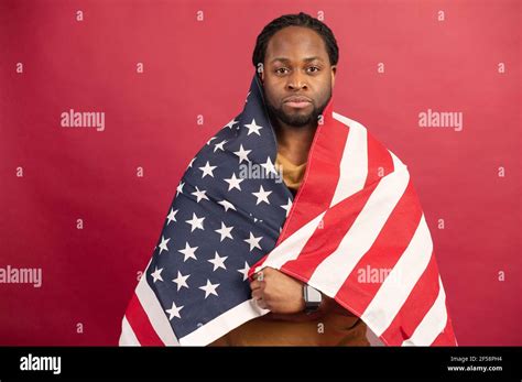 Confident African American man fighter for rights standing covered with ...