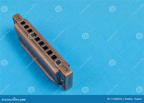 Old Harmonica on a Blue Background. Stock Photo - Image of blues, retro: 111582410