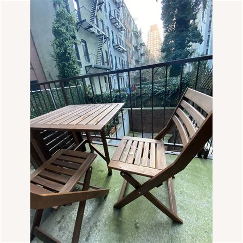 IKEA Expandable Wood Outdoor Table w/ 2 Folding Chairs - AptDeco